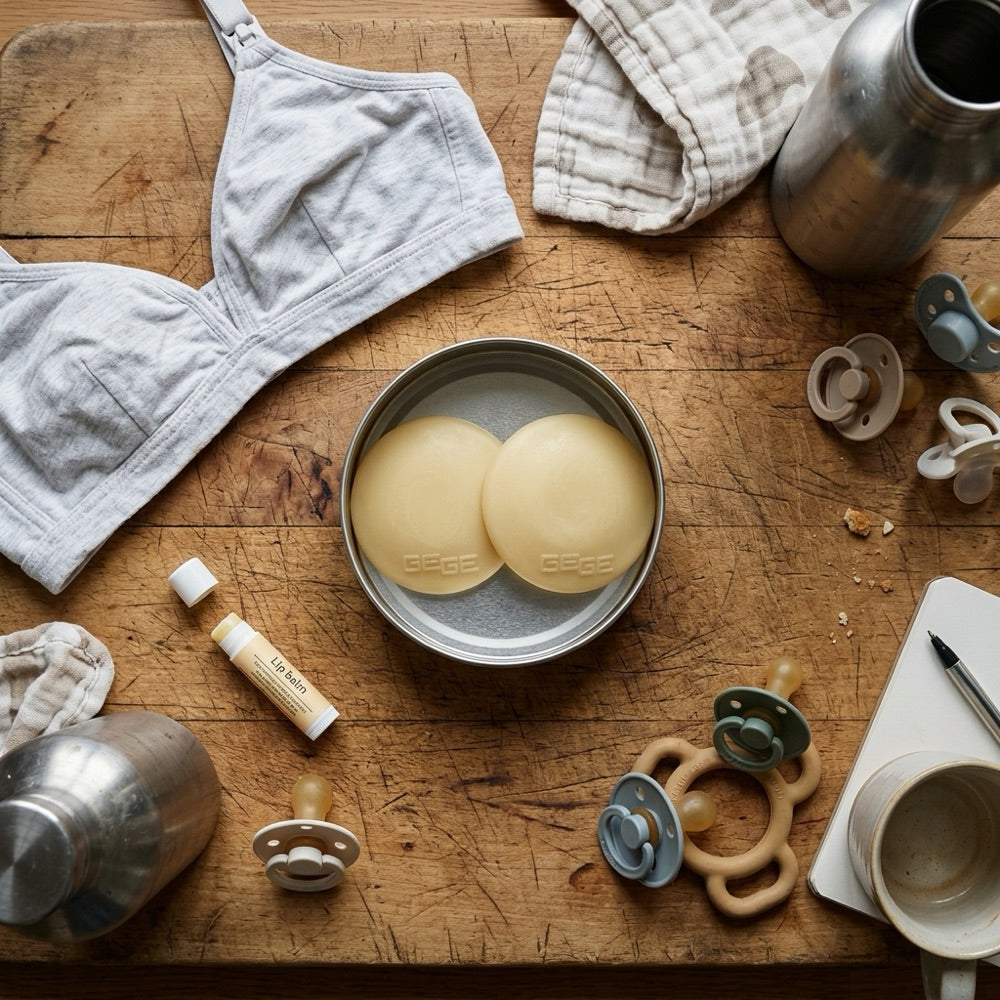 BOOBEES discs in their tin next to a nursing bra